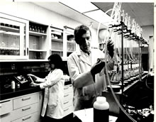 Scientists Verdel Dawson and Sharon Abidi anaylyzing samples in the Chemistry Lab