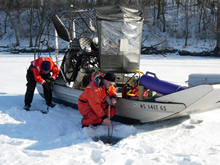 Wisconsin Department of Natural Resources staff winter sampling water quality on the Upper Mississippi River