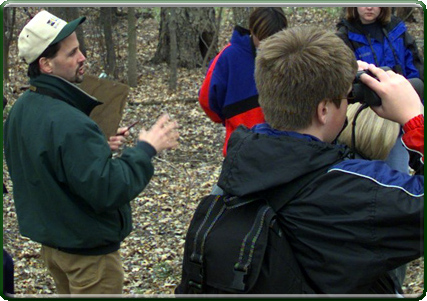 Randy Hines gives a tour of the floodplain forest by the Outdoor Classroom (photo)
